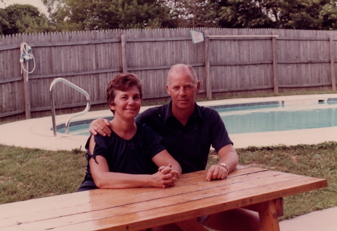 Bob and Dorothy Oliver sitting at a picnic table by the swimming pool on the property where they lived for deacades in Mason, West Virginia