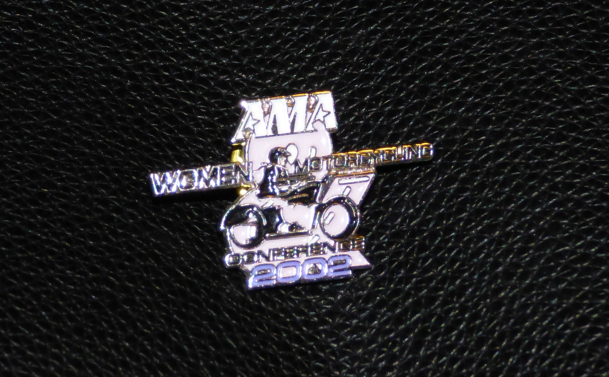 pin from the 2002 AMA Women and Motorcycling Conference
