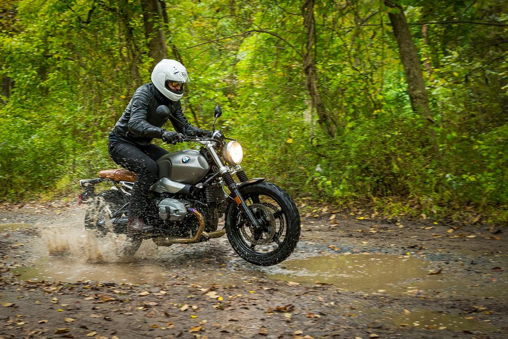 BMW R nineT Scrambler riding through the woods