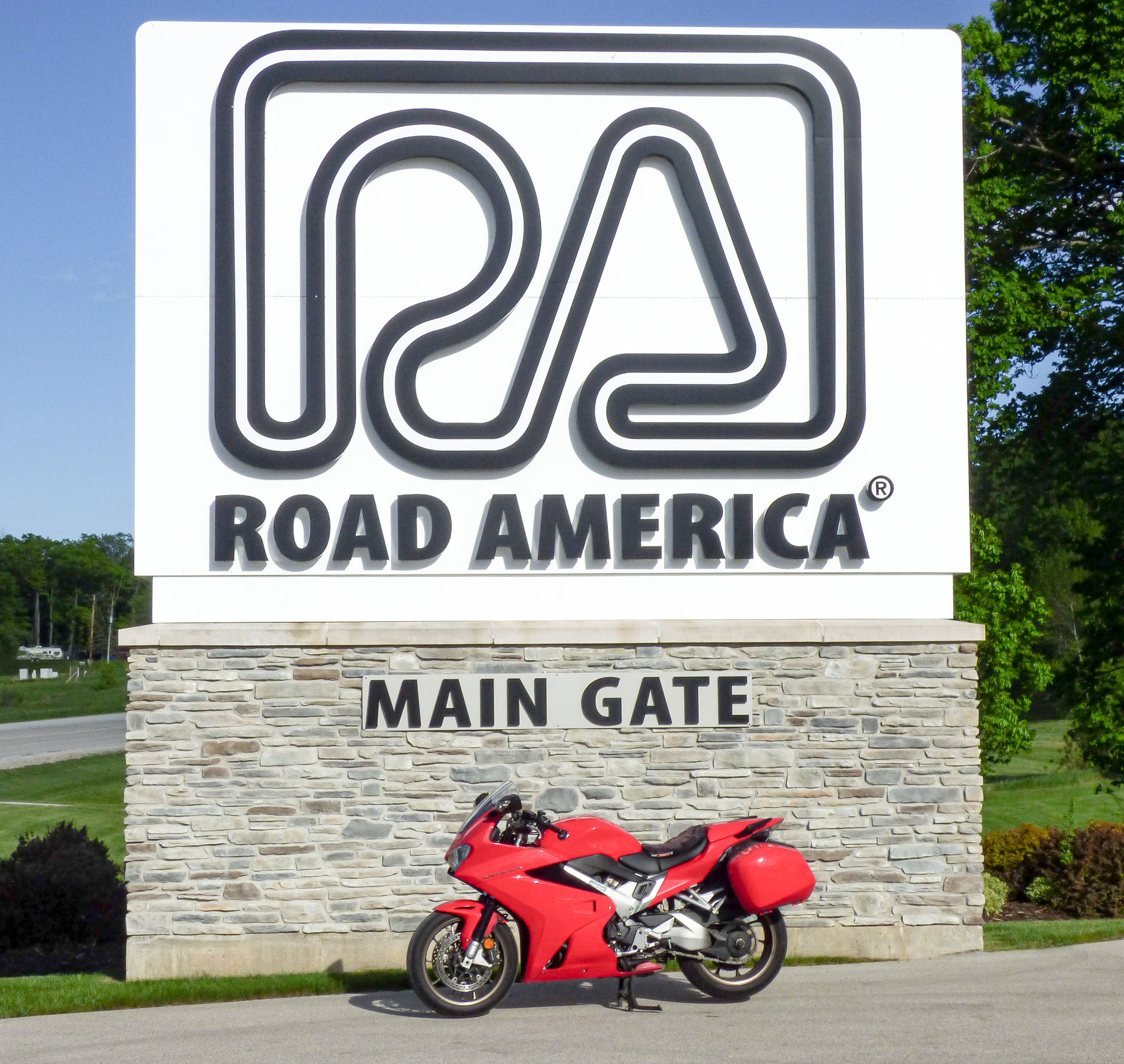 2014 Honda VFR800 Interceptor in front of the Road America race track sign