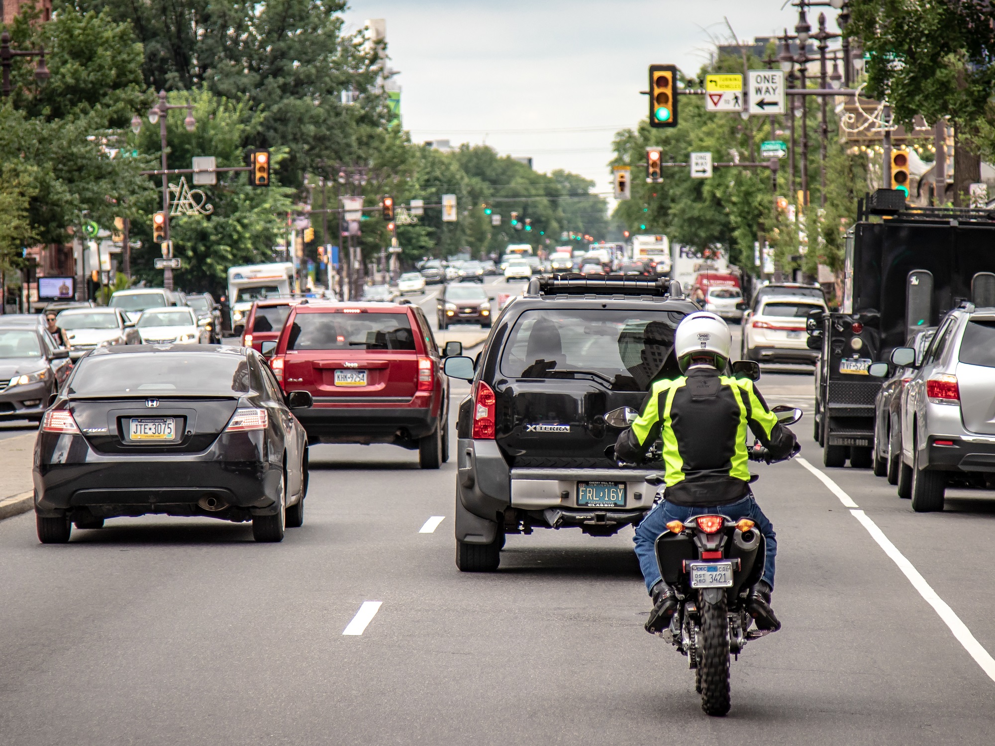Honda dual-sport motorcycle in city traffic